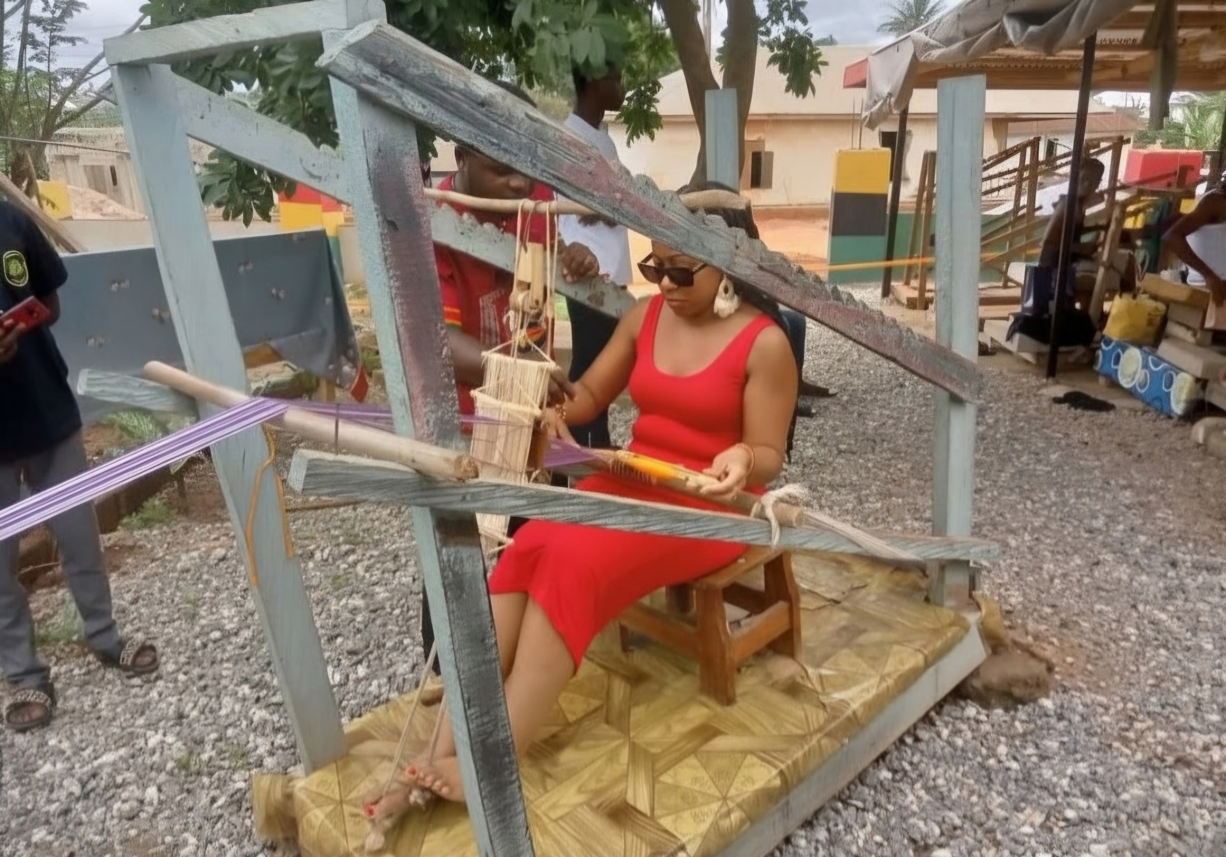 A traveller learning about Adinkra craft